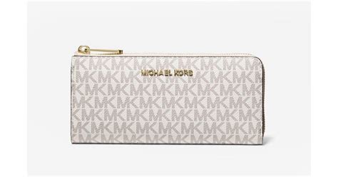 michael kors jet set zip around logo wallet|Michael Kors vanilla jet set.